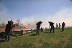 Picture of television crews filming the action of the Wilson's Creek Prescribed Fire.