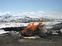 Pile burning near the Alaska Range.