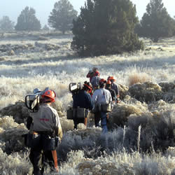 Firefighters hiking into the Modoc War Cultural Landscape.