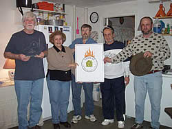 Four men and a women posing with a Firewise poster.