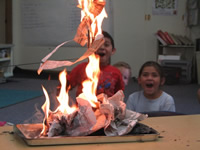Students watching a laboratory-controlled fire experiment.