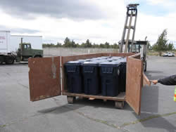 Recycling cart containig recycling bins.