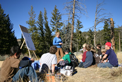 TSS graduate student Sarah Fuller posts her group's research findings from their fire ecology research at Yellowstone National Park.