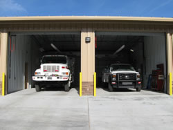 The new fire station's covered engine bay housing two wildland fire engines.