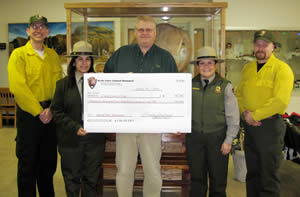 Park Service officials presenting the grant to the Crook County Volunteer Fire Department