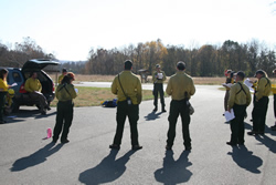 Burn Boss, Scott Beacham, briefs the firefighters before igniting the prescribed fire.