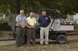 Mike Peck, New River Gorge, Shane Wheeler, Chief, Mt. Hope VFD, and Kermit Foster, Assistant Chief, Mt. Hope VFD, with a skid unit.