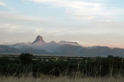 Smoke lingers on the horizon after a wildfire burned in Brown Canyon.