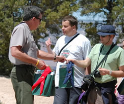 Dan Oltrogge, the park’s chief of fire and aviation, exchanges gifts with the Slovenian delegation.