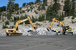 Rock is loaded into large buckets to be transported to the Lassen Peak Trail.