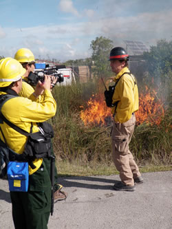 Everglades Fire Management Officer Rick Anderson explains the purpose of a test fire.