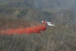 An airtanker makes as retardant drop.