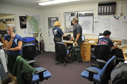 Four persons working in the Yosemite National Park Joint Information Center during the Motor Fire, August 26, 2011.