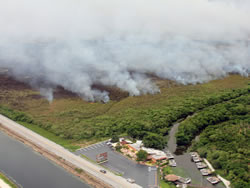 An aerial view of the fire burning near Highway 41 and the tour facilities.
