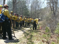 Burn boss, David Crary, lights a test fire.