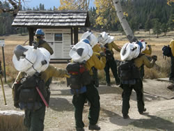 The Sierra Hotshots packing fire hose.